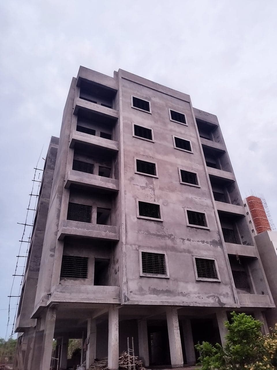 Front of the Genesis Lofts building with balconies and window grills