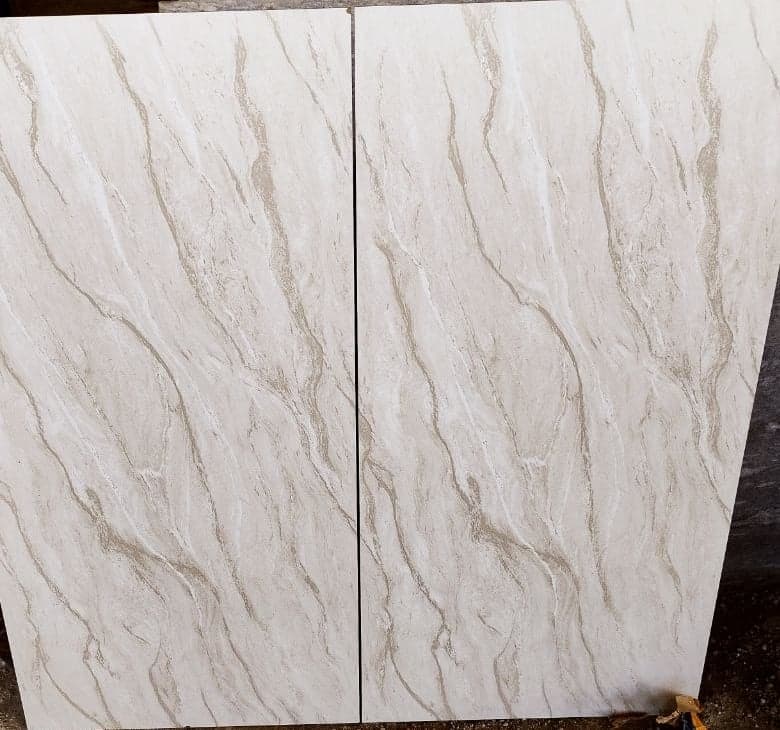 Marble-finish floor tiles selected for Genesis Lofts